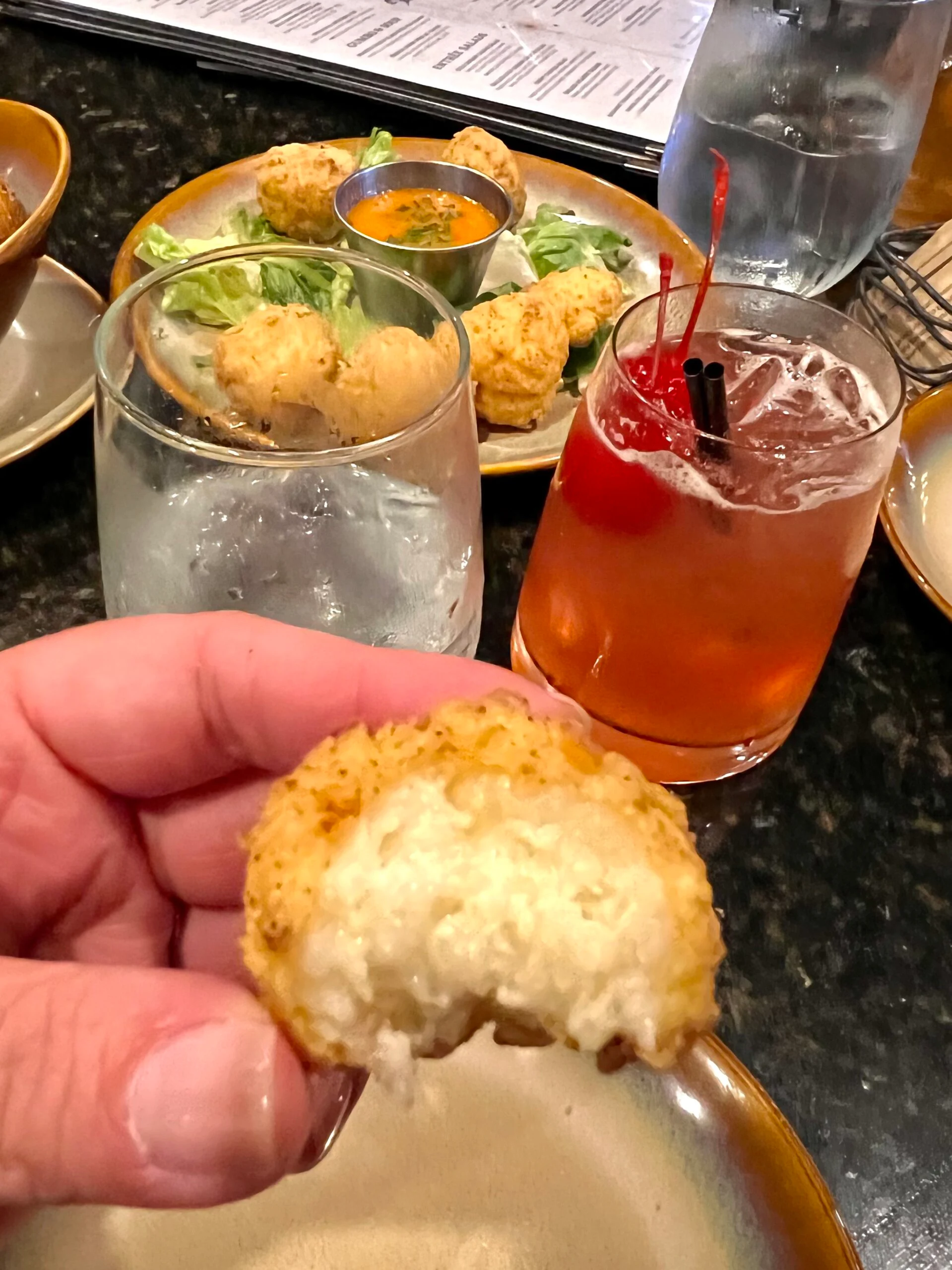 close up of grit tots with a bite out of it