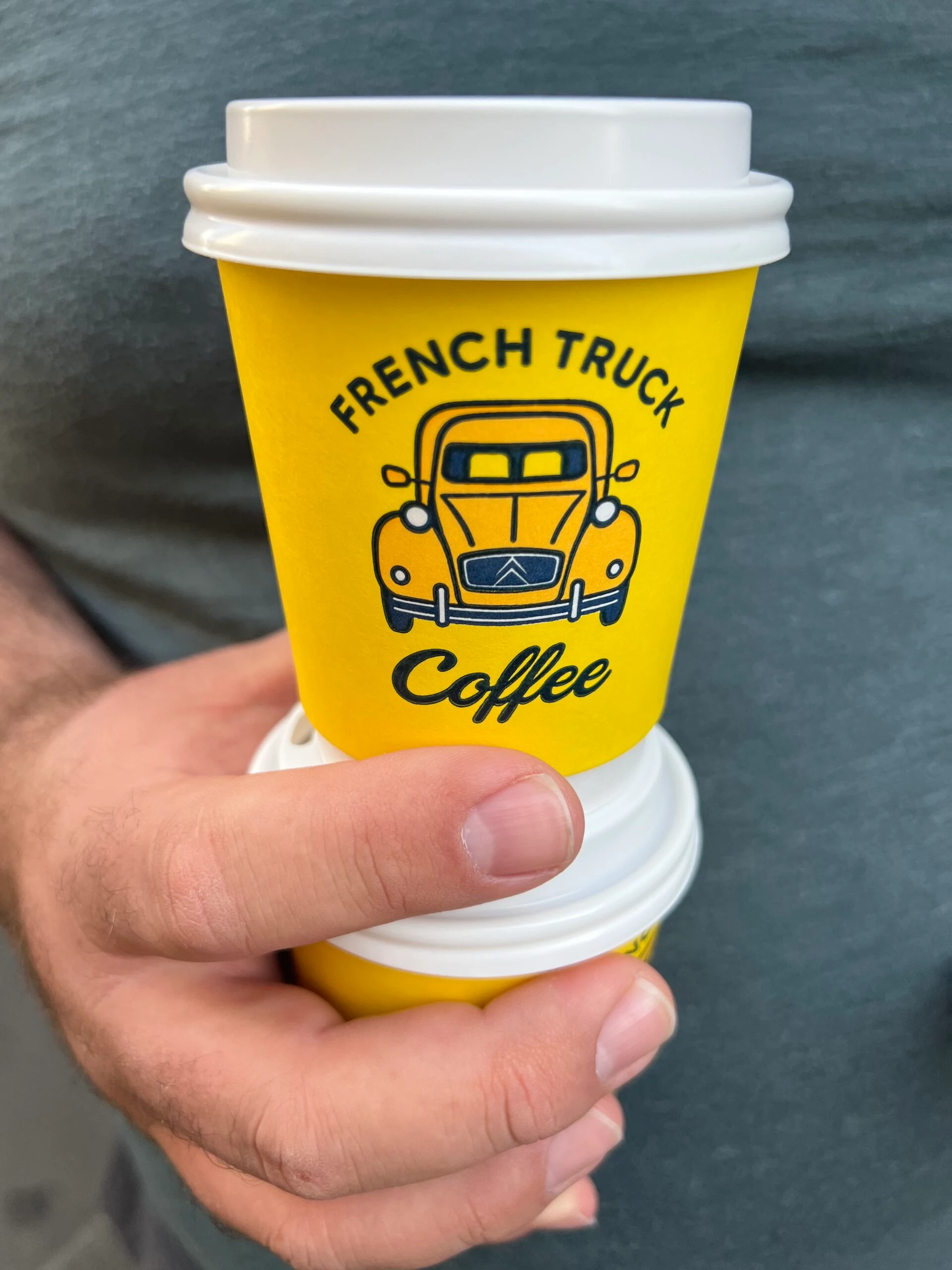 two small coffee cups (cortados) stacked on top of each other
