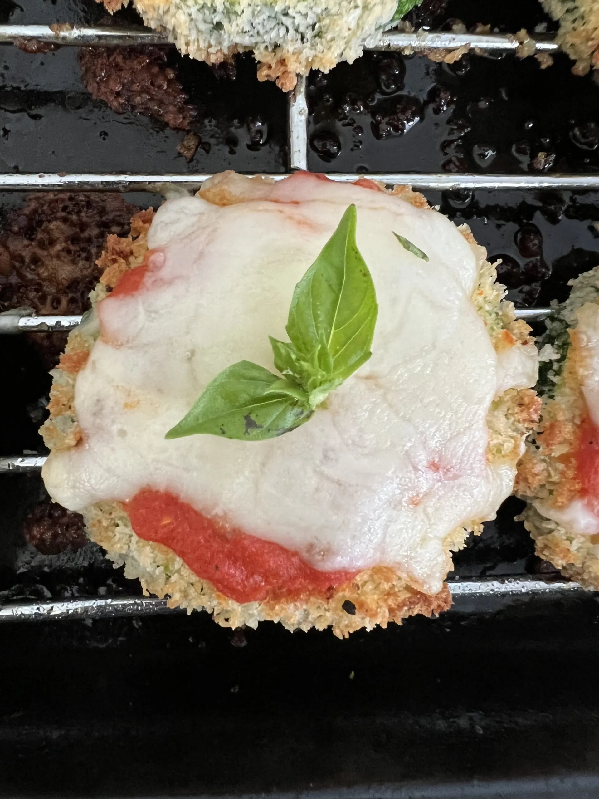zucchini parmesan on a cooling rack